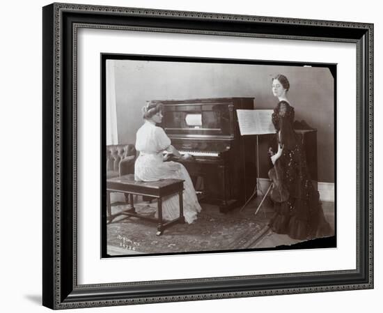 Women Playing a Player Piano and a Violin, New York, 1907-Byron Company-Framed Giclee Print