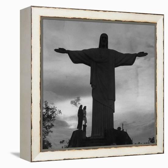 Women Posing with the Statue Called "Christ the Redeemer"-Hart Preston-Framed Premier Image Canvas