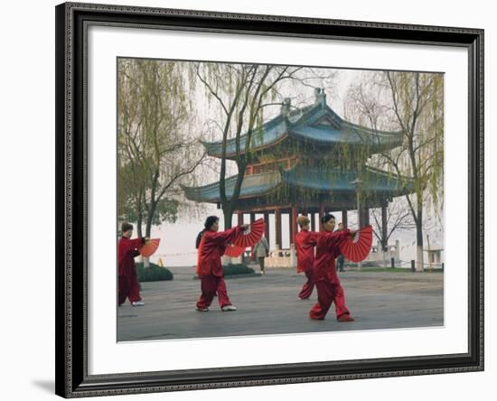 Women Practising Tai Chi in Front of a Pavilion on West Lake, Hangzhou, Zhejiang Province, China-Kober Christian-Framed Photographic Print