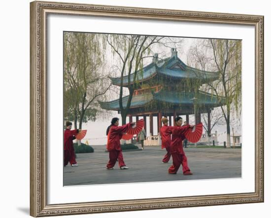 Women Practising Tai Chi in Front of a Pavilion on West Lake, Hangzhou, Zhejiang Province, China-Kober Christian-Framed Photographic Print