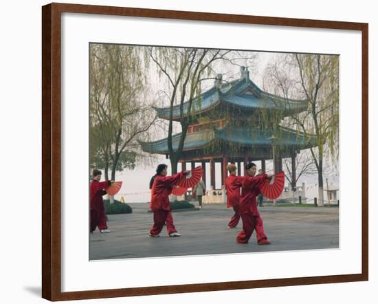 Women Practising Tai Chi in Front of a Pavilion on West Lake, Hangzhou, Zhejiang Province, China-Kober Christian-Framed Photographic Print