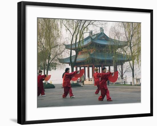 Women Practising Tai Chi in Front of a Pavilion on West Lake, Hangzhou, Zhejiang Province, China-Kober Christian-Framed Photographic Print