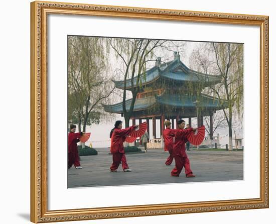 Women Practising Tai Chi in Front of a Pavilion on West Lake, Hangzhou, Zhejiang Province, China-Kober Christian-Framed Photographic Print