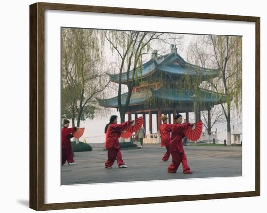 Women Practising Tai Chi in Front of a Pavilion on West Lake, Hangzhou, Zhejiang Province, China-Kober Christian-Framed Photographic Print