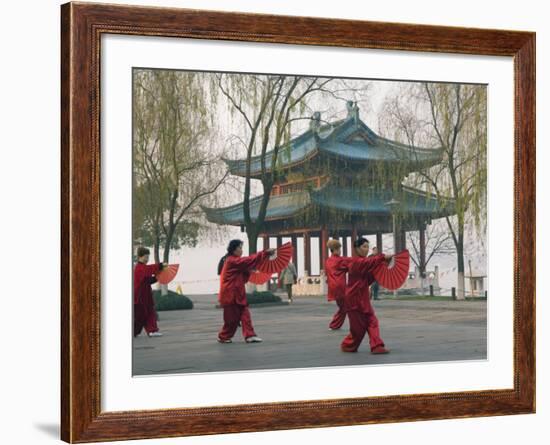 Women Practising Tai Chi in Front of a Pavilion on West Lake, Hangzhou, Zhejiang Province, China-Kober Christian-Framed Photographic Print