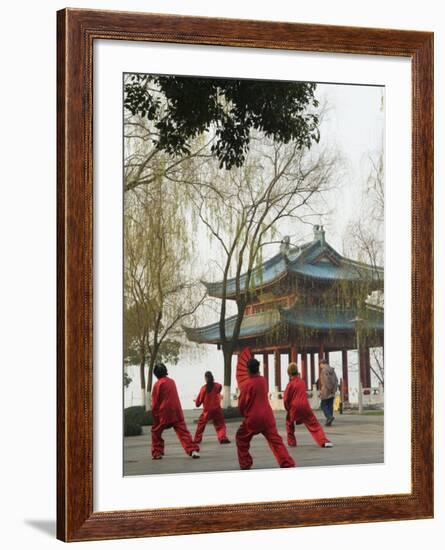 Women Practising Tai Chi in Front of a Pavilion on West Lake, Hangzhou, Zhejiang Province, China-Kober Christian-Framed Photographic Print