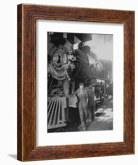 Women Rail Workers Standing at Work on Engine of Train, During WWI at Great Northern Railway-null-Framed Photographic Print