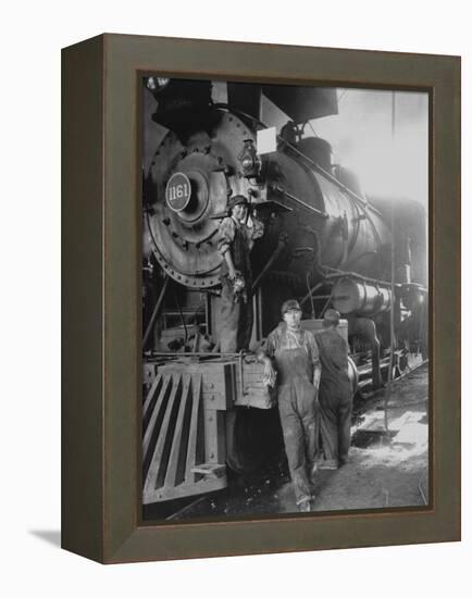 Women Rail Workers Standing at Work on Engine of Train, During WWI at Great Northern Railway-null-Framed Premier Image Canvas