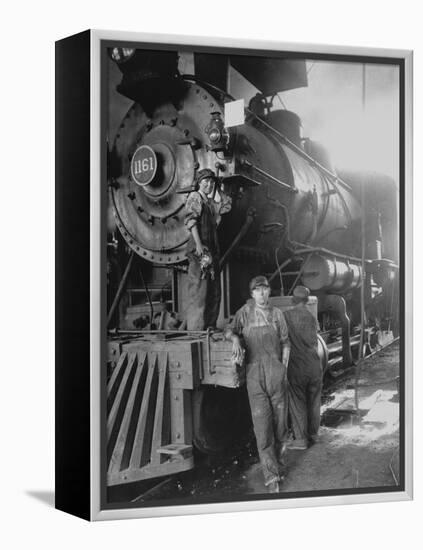 Women Rail Workers Standing at Work on Engine of Train, During WWI at Great Northern Railway-null-Framed Premier Image Canvas