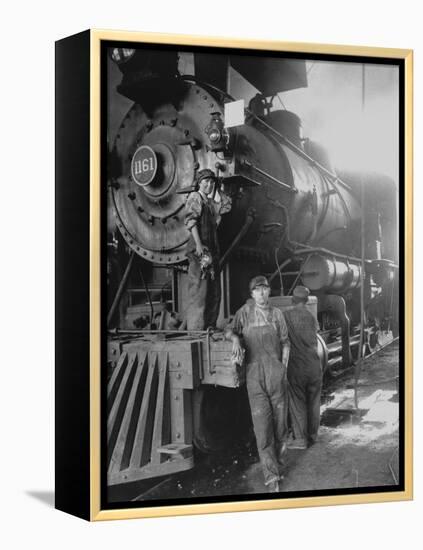 Women Rail Workers Standing at Work on Engine of Train, During WWI at Great Northern Railway-null-Framed Premier Image Canvas