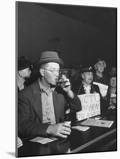 Women's Christian Temperance Union Members Raiding Local Bar Carrying Signs-Peter Stackpole-Mounted Photographic Print