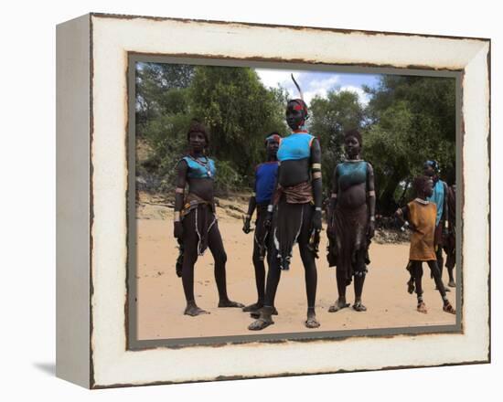 Women Sing and Dance Before the Bull Jumping, Turmi, Ethiopia-Jane Sweeney-Framed Premier Image Canvas