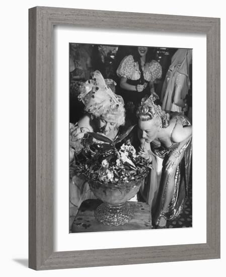 Women Sipping Punch Out of Big Bowl at Globetrotters Costume Party-Peter Stackpole-Framed Photographic Print