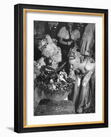 Women Sipping Punch Out of Big Bowl at Globetrotters Costume Party-Peter Stackpole-Framed Photographic Print