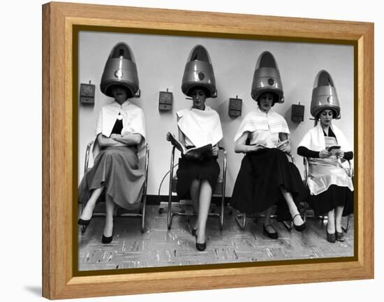 Women Sitting and Reading under Hairdryers at Rockefeller Center "Pamper Club"-Nina Leen-Framed Premier Image Canvas