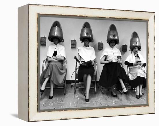 Women Sitting and Reading under Hairdryers at Rockefeller Center "Pamper Club"-Nina Leen-Framed Premier Image Canvas