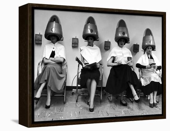 Women Sitting and Reading under Hairdryers at Rockefeller Center "Pamper Club"-Nina Leen-Framed Premier Image Canvas