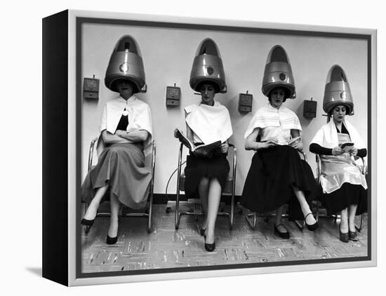 Women Sitting and Reading under Hairdryers at Rockefeller Center "Pamper Club"-Nina Leen-Framed Premier Image Canvas