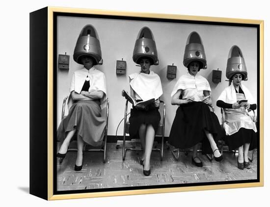 Women Sitting and Reading under Hairdryers at Rockefeller Center "Pamper Club"-Nina Leen-Framed Premier Image Canvas