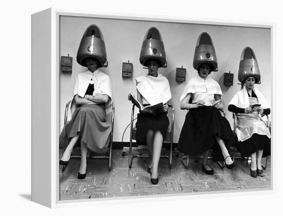 Women Sitting and Reading under Hairdryers at Rockefeller Center "Pamper Club"-Nina Leen-Framed Premier Image Canvas