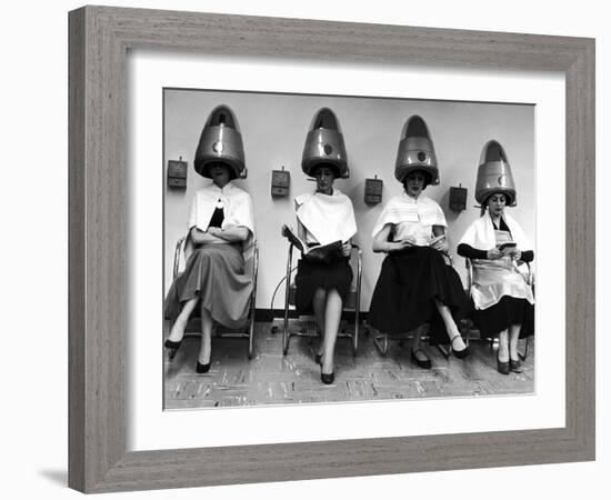 Women Sitting and Reading under Hairdryers at Rockefeller Center "Pamper Club"-Nina Leen-Framed Photographic Print