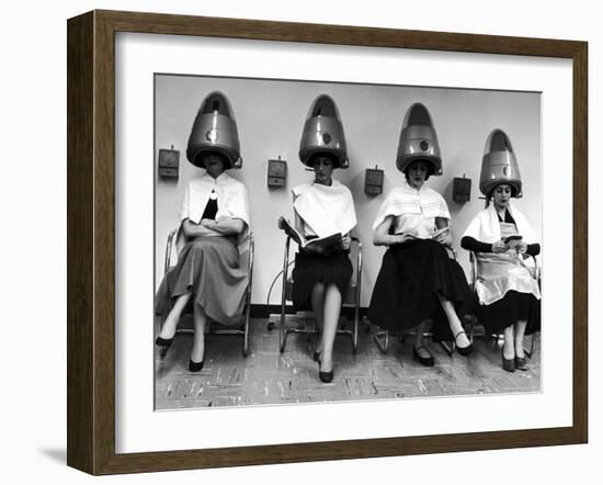 Women Sitting and Reading under Hairdryers at Rockefeller Center "Pamper Club"-Nina Leen-Framed Photographic Print