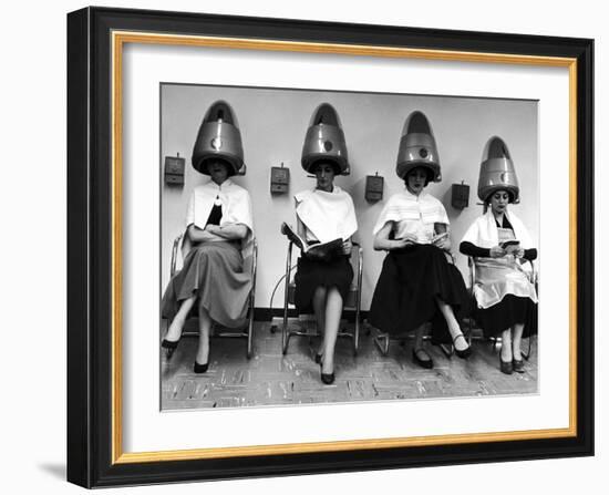 Women Sitting and Reading under Hairdryers at Rockefeller Center "Pamper Club"-Nina Leen-Framed Photographic Print