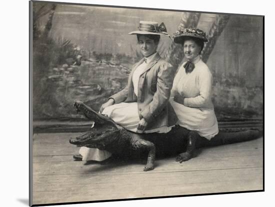 Women Sitting on a Stuffed Alligator, C.1905-null-Mounted Photographic Print