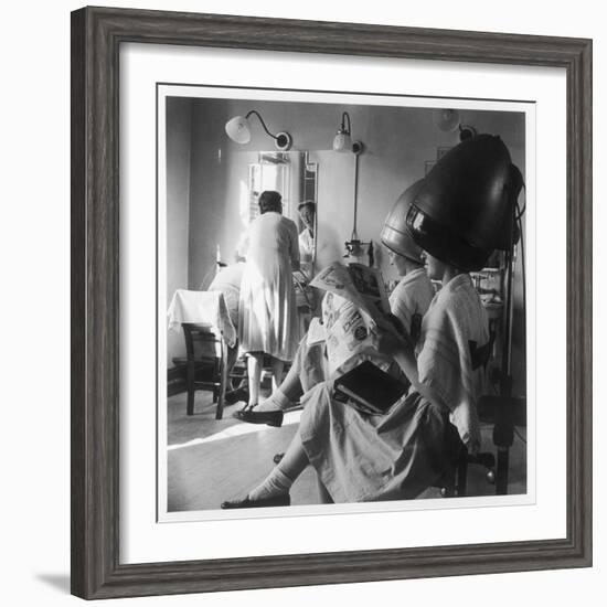 Women Sitting under Hair Dryers at the Hairdressers-Henry Grant-Framed Photographic Print