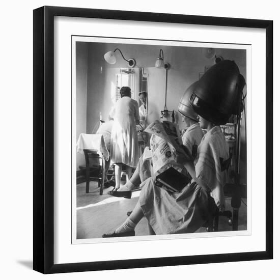 Women Sitting under Hair Dryers at the Hairdressers-Henry Grant-Framed Photographic Print