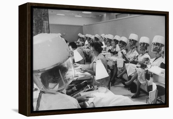 Women under Hair Dryers Getting Hair Styled in Beauty Salon at Saks Fifth Ave. Department Store-Alfred Eisenstaedt-Framed Premier Image Canvas