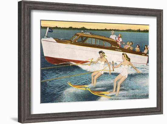 Women Waterskiing by Motorboat-null-Framed Art Print