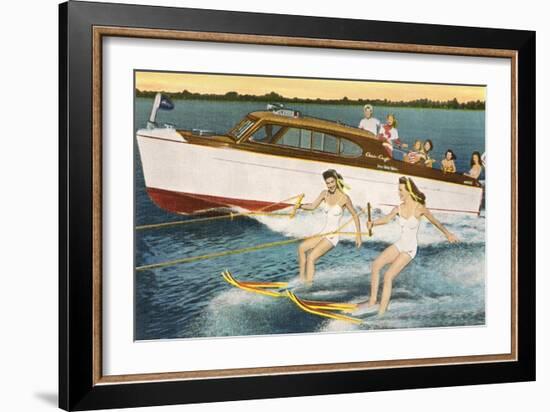 Women Waterskiing by Motorboat-null-Framed Art Print