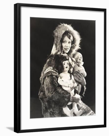 Women Wearing Eskimo Fur Coat Holding Dolls-null-Framed Photo