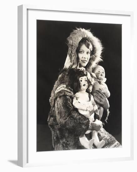 Women Wearing Eskimo Fur Coat Holding Dolls-null-Framed Photo