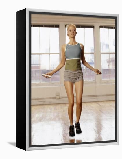 Women Working Out with Jump Rope in Fitness Studio, New York, New York, USA-Chris Trotman-Framed Premier Image Canvas