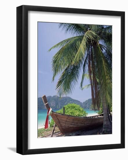 Wooden Boat Beneath Palm Trees on Beach, off the Island of Phuket, Thailand-Ruth Tomlinson-Framed Photographic Print