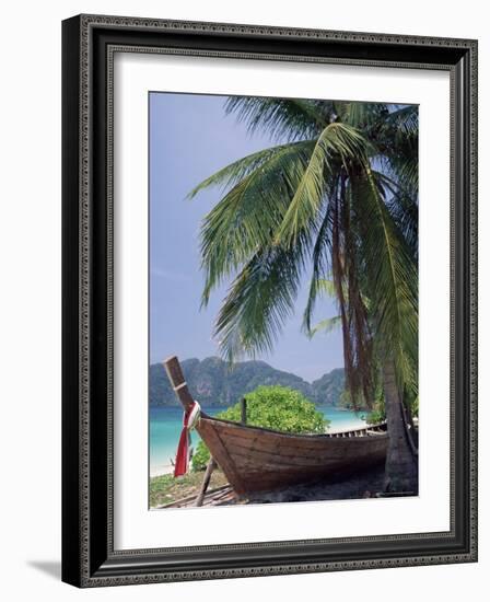 Wooden Boat Beneath Palm Trees on Beach, off the Island of Phuket, Thailand-Ruth Tomlinson-Framed Photographic Print