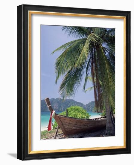 Wooden Boat Beneath Palm Trees on Beach, off the Island of Phuket, Thailand-Ruth Tomlinson-Framed Photographic Print