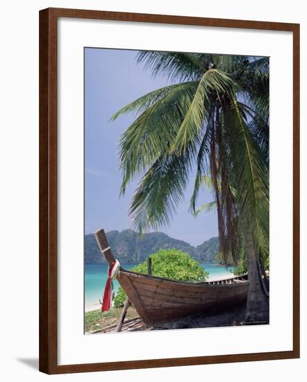 Wooden Boat Beneath Palm Trees on Beach, off the Island of Phuket, Thailand-Ruth Tomlinson-Framed Photographic Print