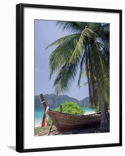 Wooden Boat Beneath Palm Trees on Beach, off the Island of Phuket, Thailand-Ruth Tomlinson-Framed Photographic Print