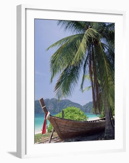 Wooden Boat Beneath Palm Trees on Beach, off the Island of Phuket, Thailand-Ruth Tomlinson-Framed Photographic Print