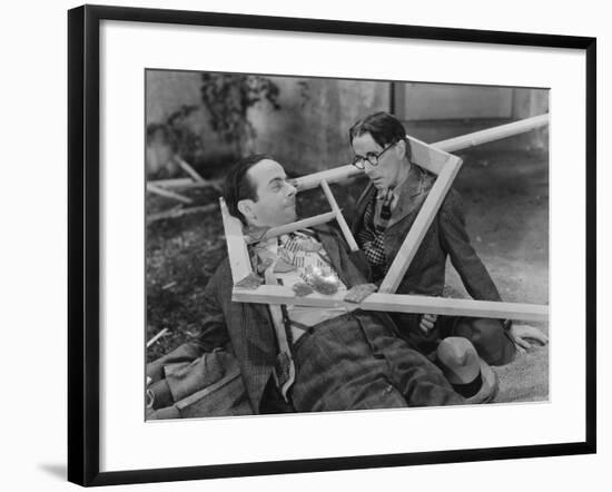 Wooden Frame Broken over Two Mens Heads-null-Framed Photo