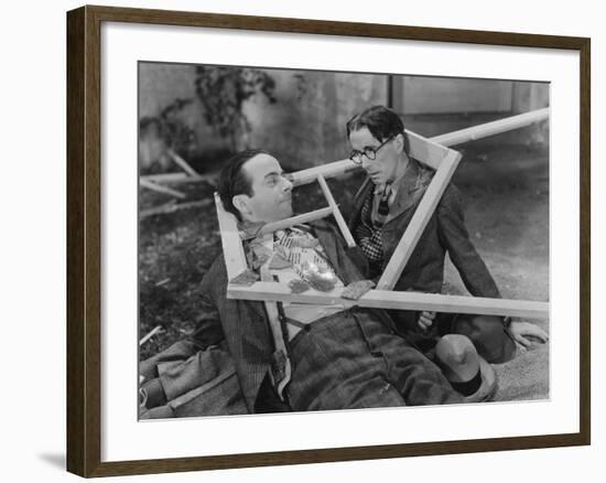 Wooden Frame Broken over Two Mens Heads-null-Framed Photo