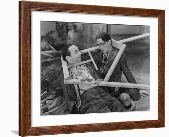 Wooden Frame Broken over Two Mens Heads-null-Framed Photo