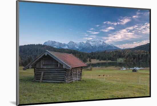 Wooden hut frames the alpine lake surrounded by the Alps, Geroldsee, Krun, Garmisch Partenkirchen, -Roberto Moiola-Mounted Photographic Print