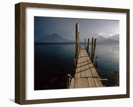 Wooden Jetty and Volcanoes in the Distance, Lago Atitlan (Lake Atitlan), Guatemala, Central America-Colin Brynn-Framed Photographic Print