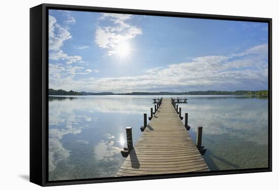 Wooden jetty in the morning with sun, Woerthsee, Fuenfseenland, Upper Bavaria, Bavaria, Germany-Raimund Linke-Framed Stretched Canvas