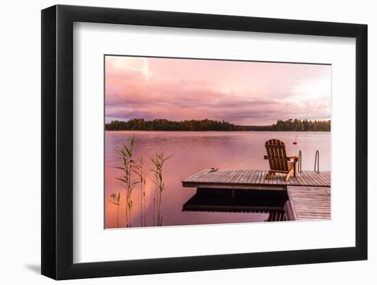 Wooden Lounge Chairs at Sunset on a Pier on the Shores of the Calm Saimaa Lake in Finland under a N-gdefilip-Framed Photographic Print