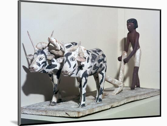 Wooden model of a man ploughing with oxen, from Egypt, Middle Kingdom, c2040-1750 BC-Unknown-Mounted Giclee Print